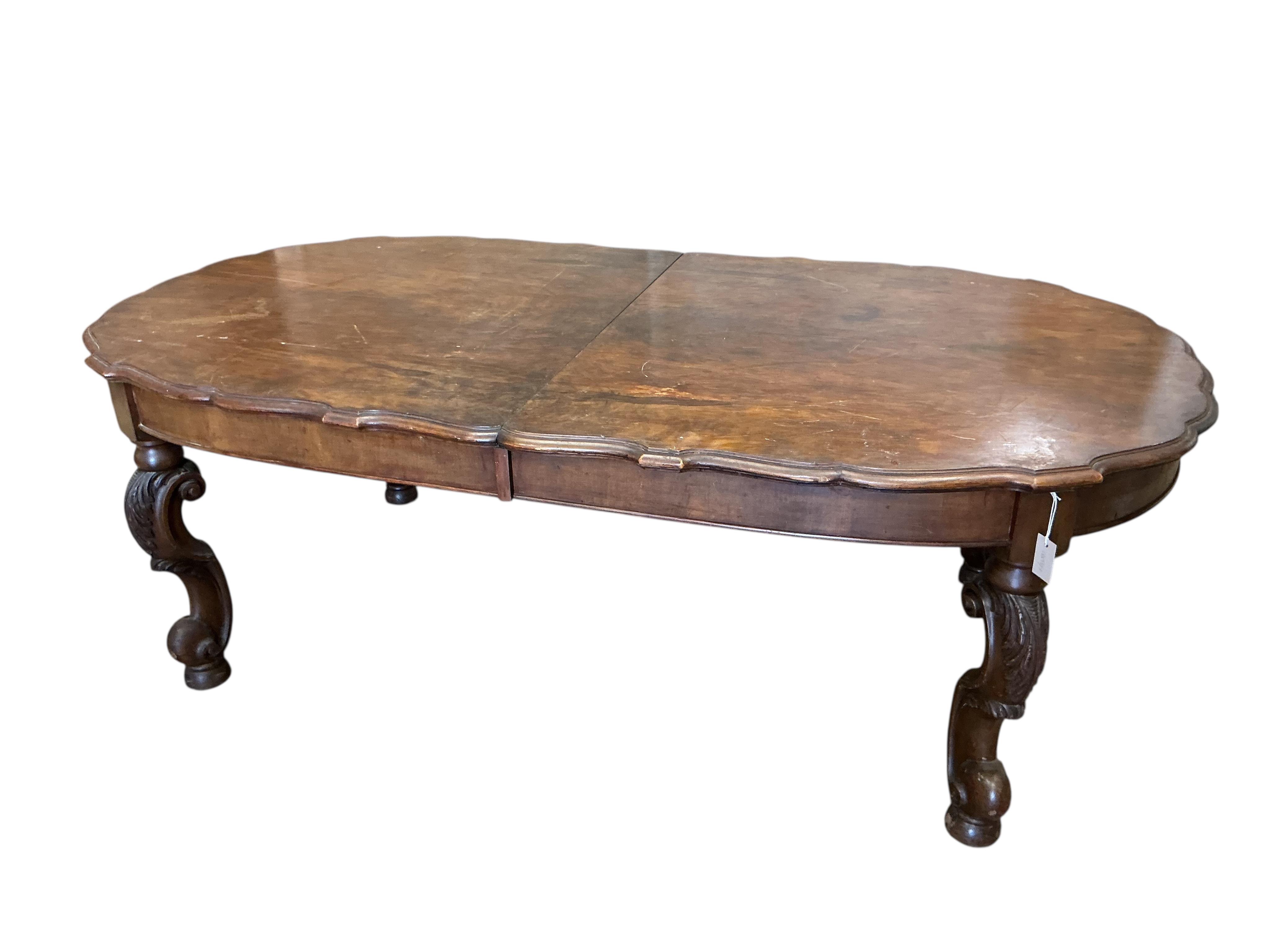 A late 19th century Continental walnut extending dining table, 264cm extended, one spare leaf, depth 114cm, height 73cm